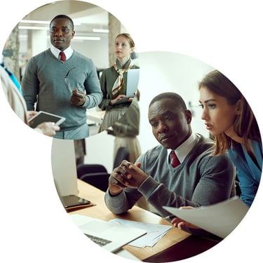 A male employee and his coworkers at a firm, which recently underwent a Cloud Security and Privacy assessment by Synergy Technical, are seen using work devices and apps powered by secure cloud technologies that enable them to be productive and streamline work.