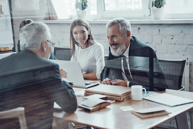 Accountants are meeting with their client using devices equipped with powerful business apps, procured and implemented to expedite work, manage sensitive files, and ensure connectivity anywhere and at any time.