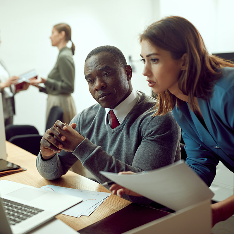 Picture of employees collaborating safely and securely in the office, seamlessly accessing workload applications through the organization's lifecycle identity and access management solution, Microsoft Entra ID Governance—leveraging automated access to cloud and on-premises apps, ensuring swift and seamless collaboration without the delays of manual approvals.